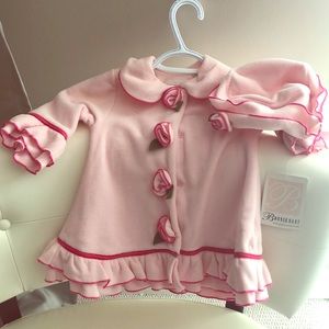 Baby coat in pink and ruffles